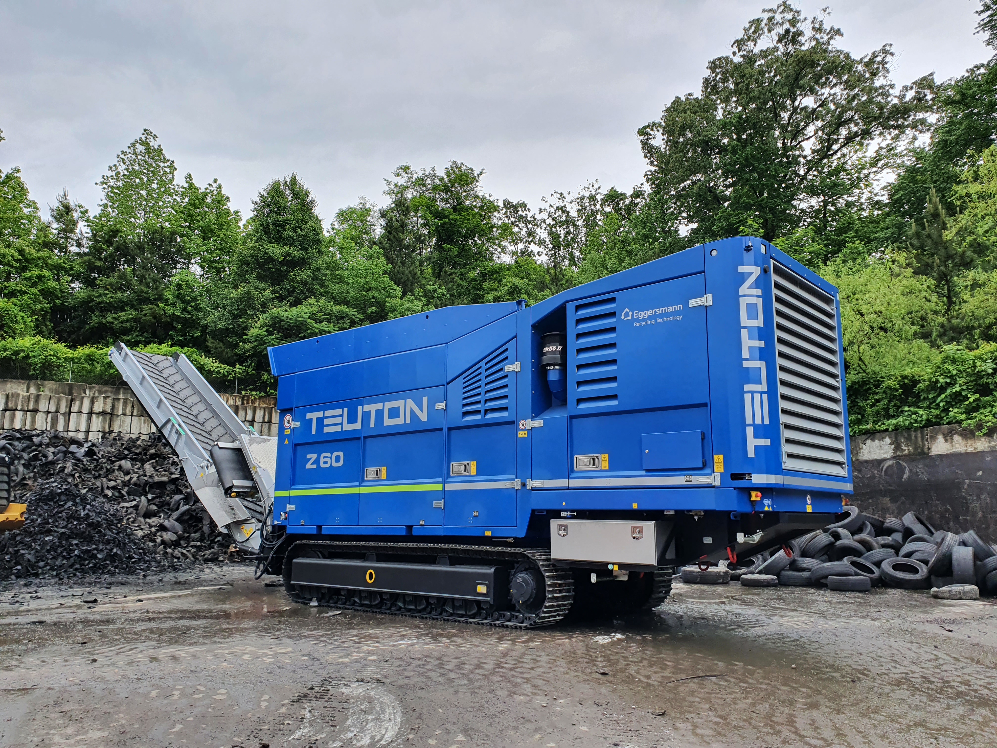 Tyre stockpile being processed for recycling
